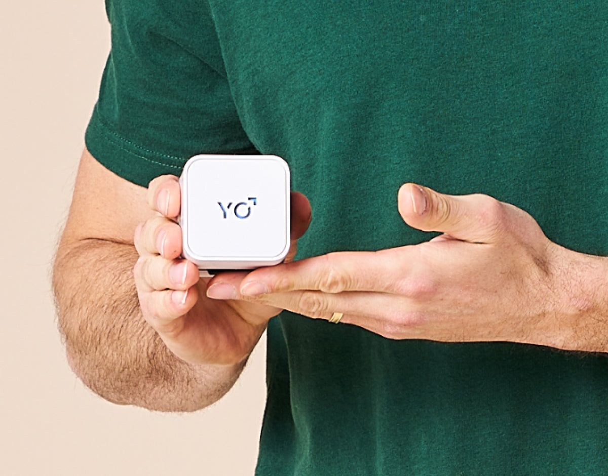 A man using the At-Home Sperm Test Kit in a comfortable home setting.