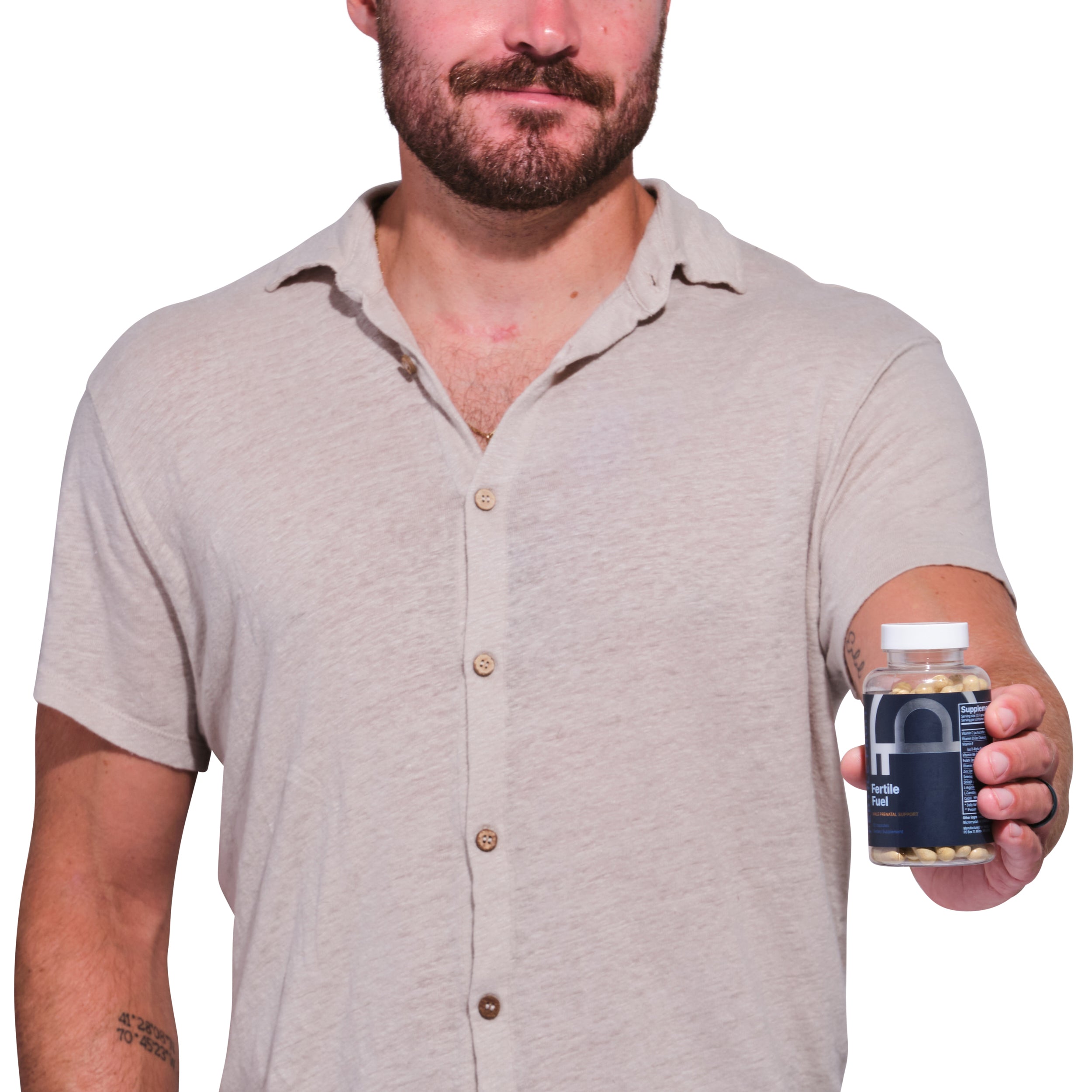 A smiling man holding a bottle of Fertile Fuel, a supplement for men's sperm count.