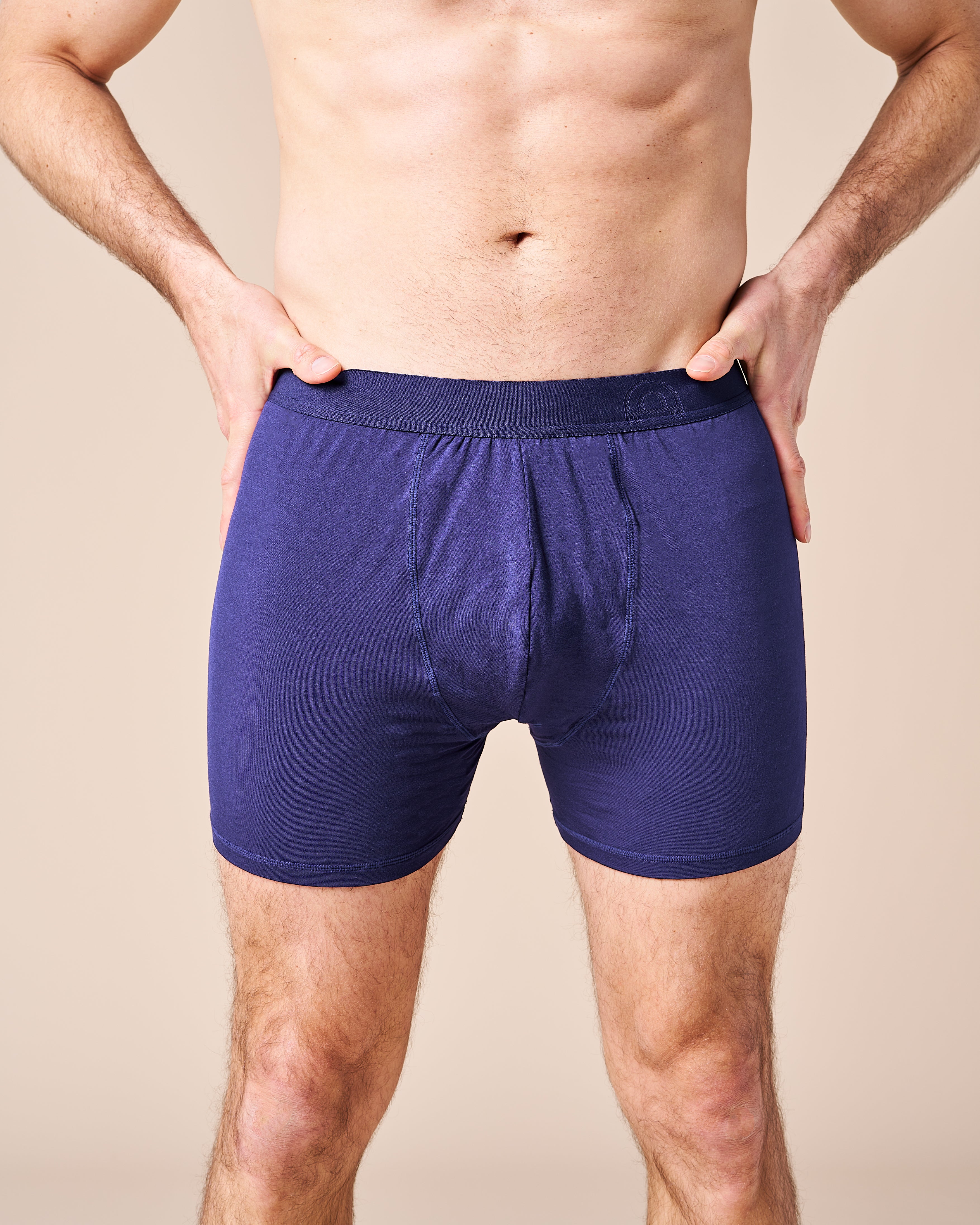 A pair of Men's Fruitful Boxer underwear, designed to increase male fertility. Navy blue boxers